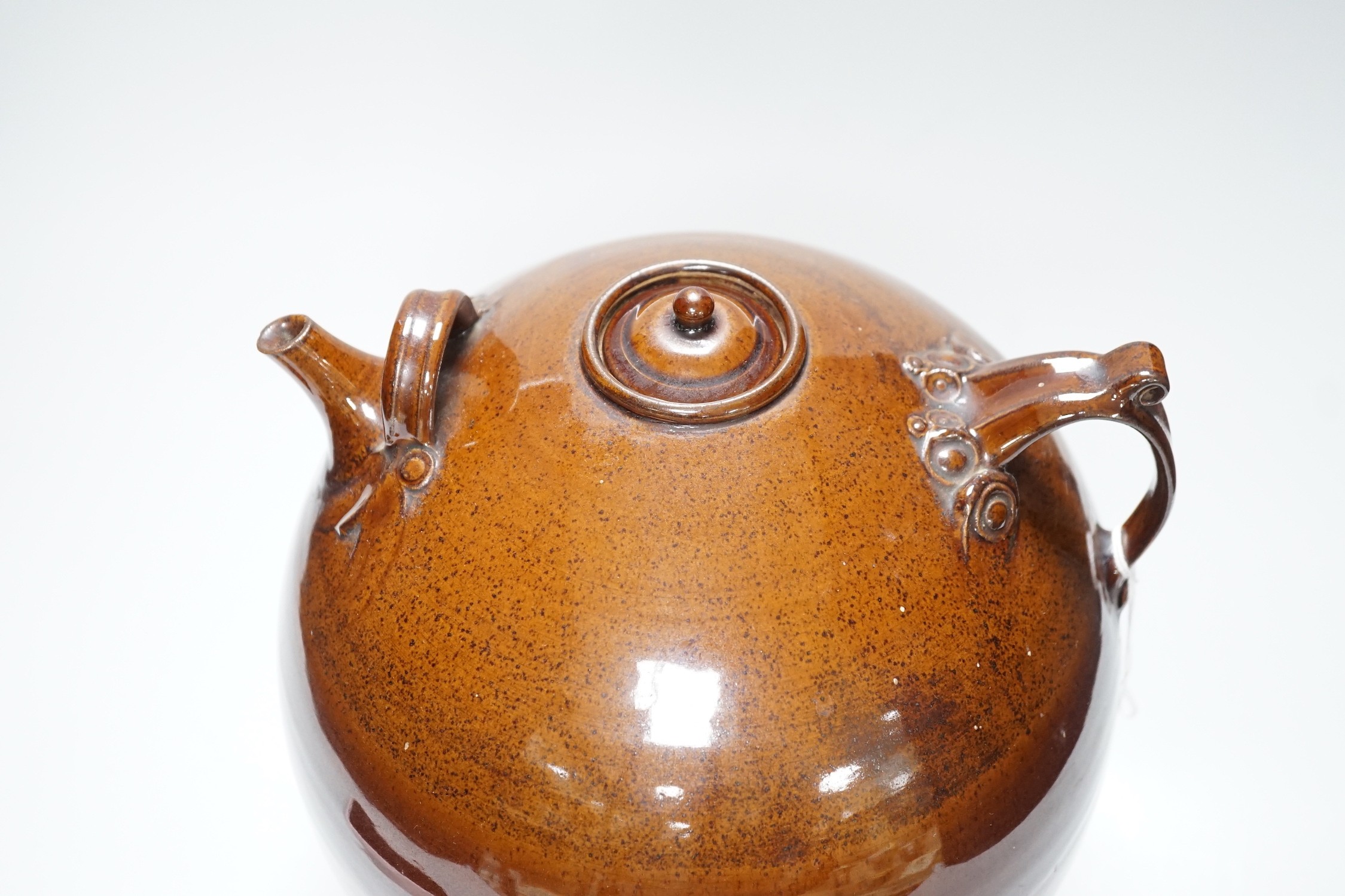 A Doug Bignell 'Alice in Wonderland' brown glazed teapot (a unique piece commissioned by the current owner), 30cms
